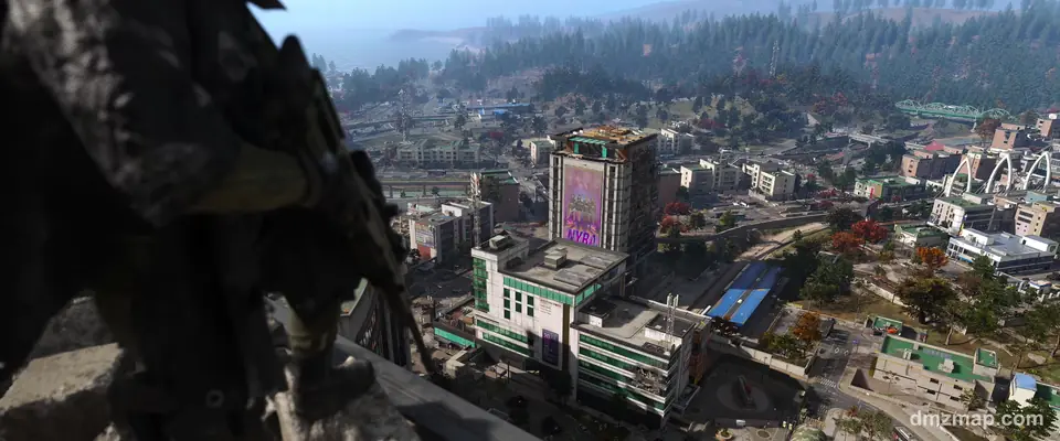 Hajin from a high ledge in MW4 DMZ: a tower with a giant poster, streets, bridges and the coast beyond, an Operator crouched in the foreground