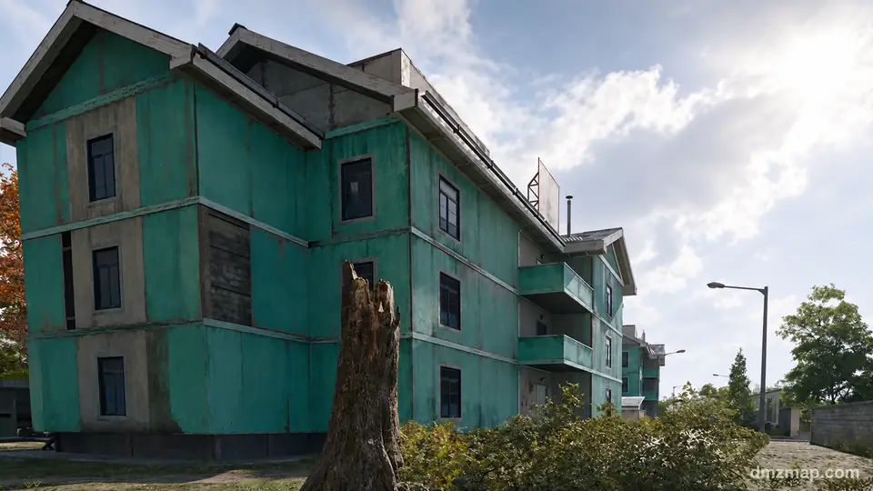 A row of turquoise three-storey apartment blocks with small balconies and gabled roofs on the east side of Deadtown, a broken tree stump in front, MW4 DMZ