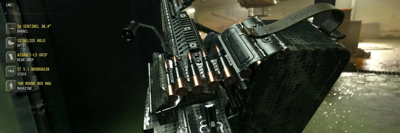 Close-up of a belt-fed machine gun with an ammo box in MW4, next to its list of attachments