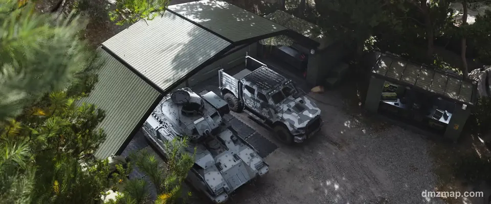 The FOB yard in MW4 DMZ from above: an armored vehicle and a camouflaged truck under a green shelter, a supply station beside them among pine trees