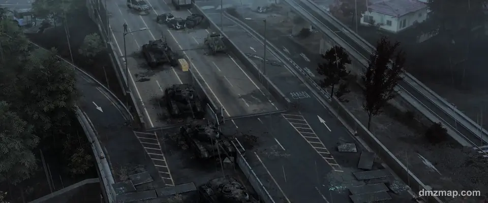 Wrecked tanks and abandoned cars on a foggy elevated highway in Hajin, MW4 DMZ, seen from above
