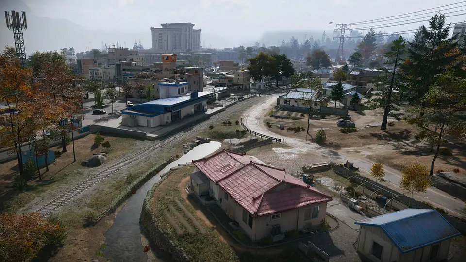 Cheongun Village in MW4 DMZ: a red-roofed house by a creek, rail tracks and a casino tower behind