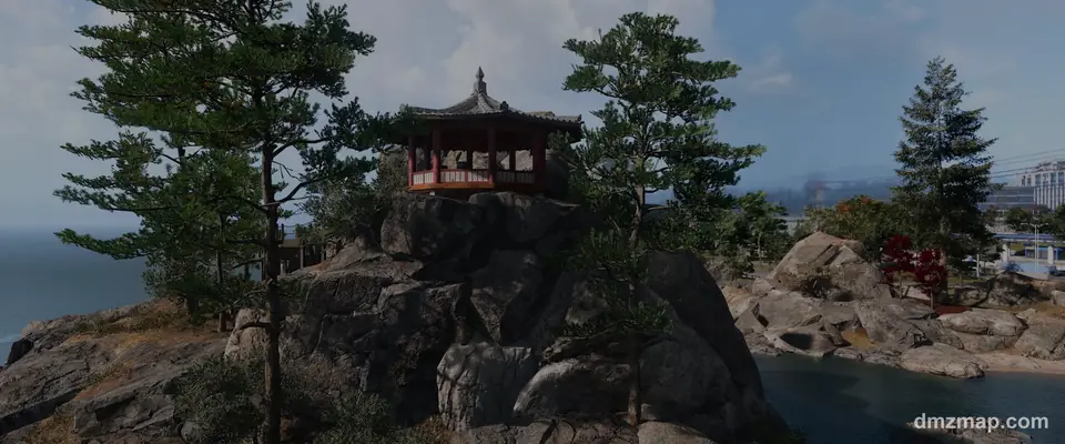 A red Korean pavilion on a rocky outcrop with pine trees by the sea in Hajin, MW4 DMZ