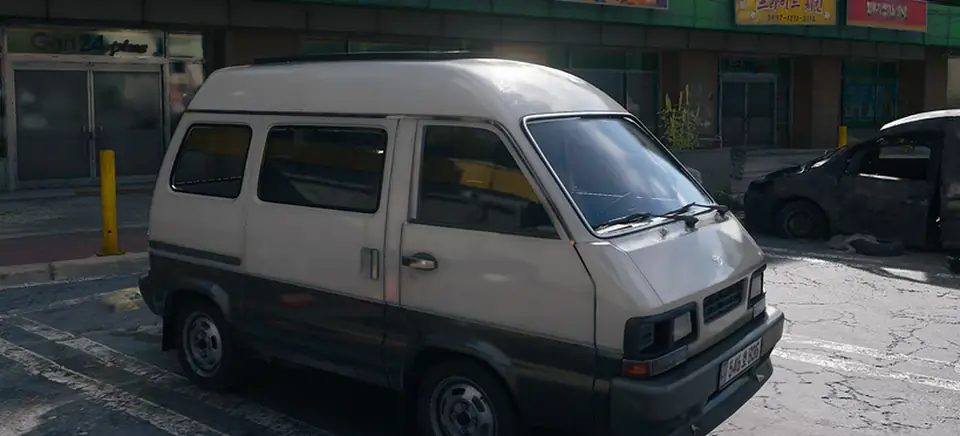 The Camper in MW4 DMZ: a beige and grey camper van parked on a cracked street